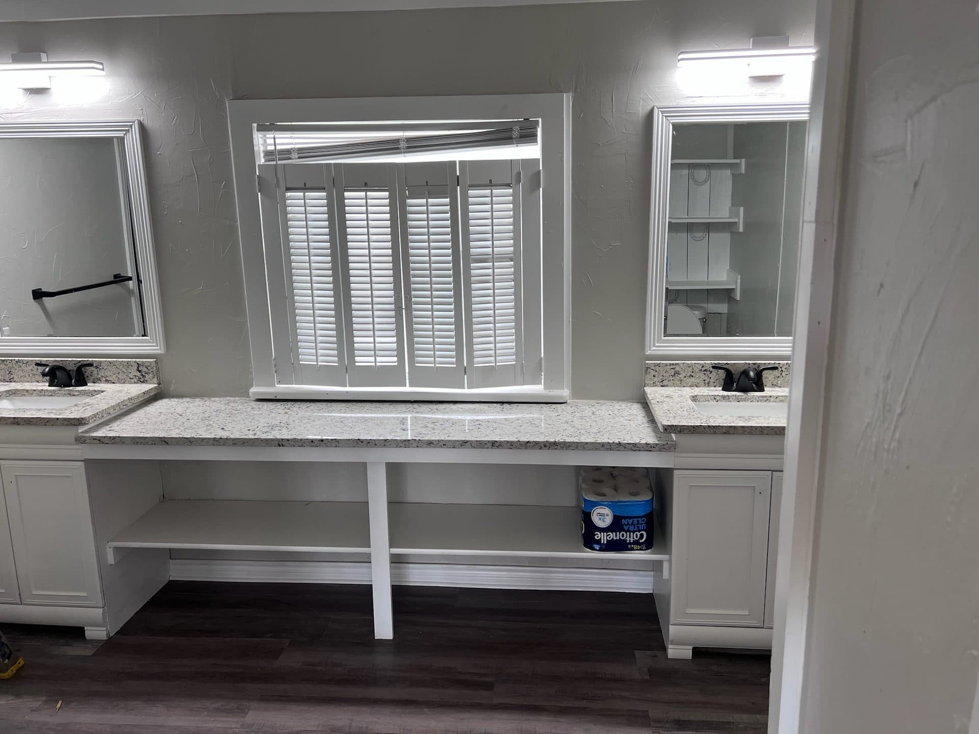 Master bath dual vanity with granite, plantation shutters, and framed mirrors